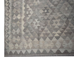 Handwoven Afghan Maiamana kilim rug featuring a grey and beige geometric diamond pattern.