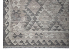 Handwoven Afghan Maimana kilim rug featuring a grey geometric diamond pattern in natural wool.