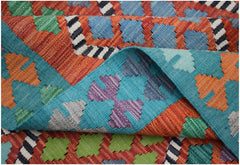 A handmade Afghan Maimana kilim rug featuring a vibrant geometric pattern in wool.
