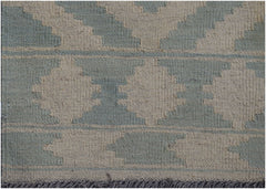 Handwoven Afghan Maimana kilim rug featuring a geometric pattern in sage green and cream wool.