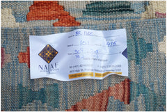 A handwoven Afghan Maimana kilim featuring a geometric pattern in blue, orange, and cream wool.