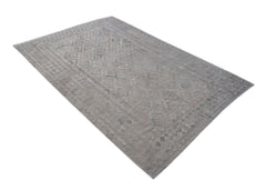 A rectangular, handwoven Afghan Maimana kilim rug featuring a subtle grey geometric pattern.