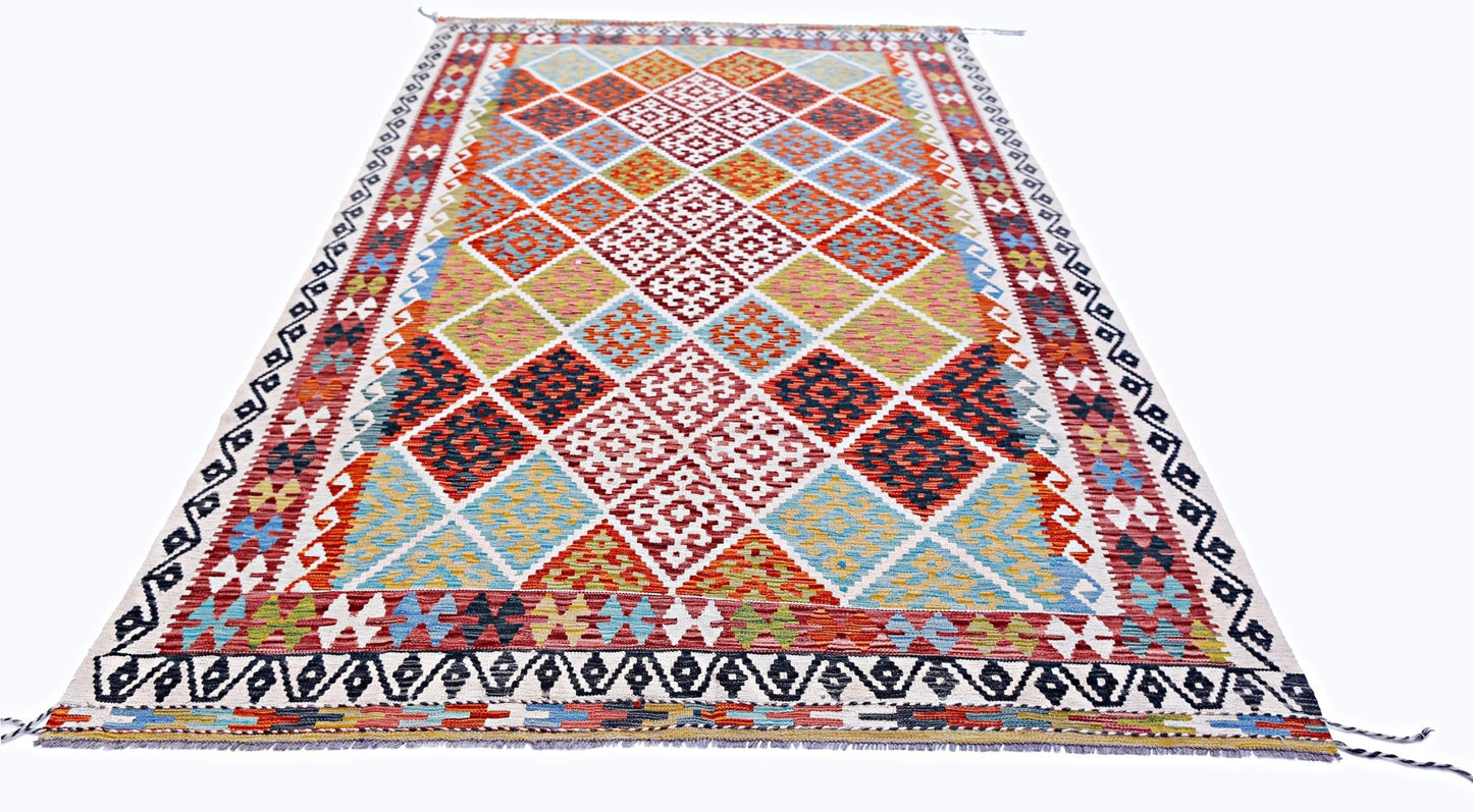 Handwoven Afghan Maimana kilim rug featuring a colorful geometric diamond pattern.