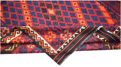 Handwoven Afghan Maimana kilim featuring a geometric pattern in red, blue, and orange wool.