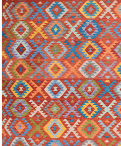 Handmade Afghan Maimana kilim rug featuring a vibrant geometric pattern in rich, warm colors.