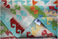 Afghan Maimana Kilim with geometric patterns in red, green, blue, and yellow.