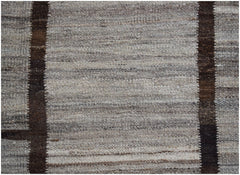 Afghan Maimana Kilim with vertical brown stripes on a textured grey background.