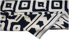 Handwoven Afghan Maimana kilim rug featuring a black and white geometric diamond pattern.