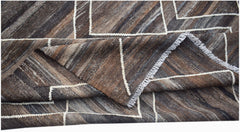 Handwoven Afghan Maimana kilim featuring a brown and grey geometric pattern in natural wool.