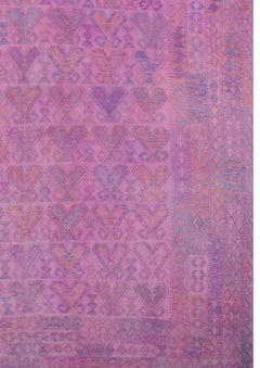 A handmade Afghan Maimana kilim rug featuring a repeating geometric pattern in shades of pink.