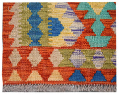 Handwoven Afghan Maimana wool kilim runner featuring a vibrant geometric pattern.