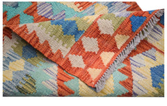 A handmade Afghan Maimana wool kilim runner featuring a colorful geometric pattern.