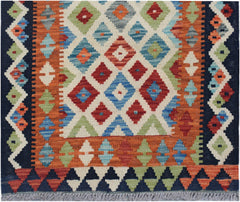Handwoven Afghan Maimana wool runner featuring a colorful geometric diamond pattern.