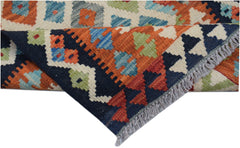 Handwoven Afghan Maimana wool kilim runner featuring a geometric pattern in vibrant colors.