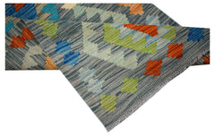 Handwoven Afghan Maimana wool runner featuring a geometric pattern in blue, orange, and green.