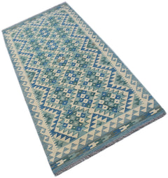Handwoven Afghan Maimana wool runner rug featuring a blue and cream geometric diamond pattern.