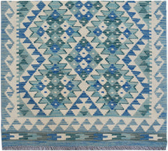 Handwoven Afghan Maimana wool runner featuring a geometric pattern in shades of blue and cream.
