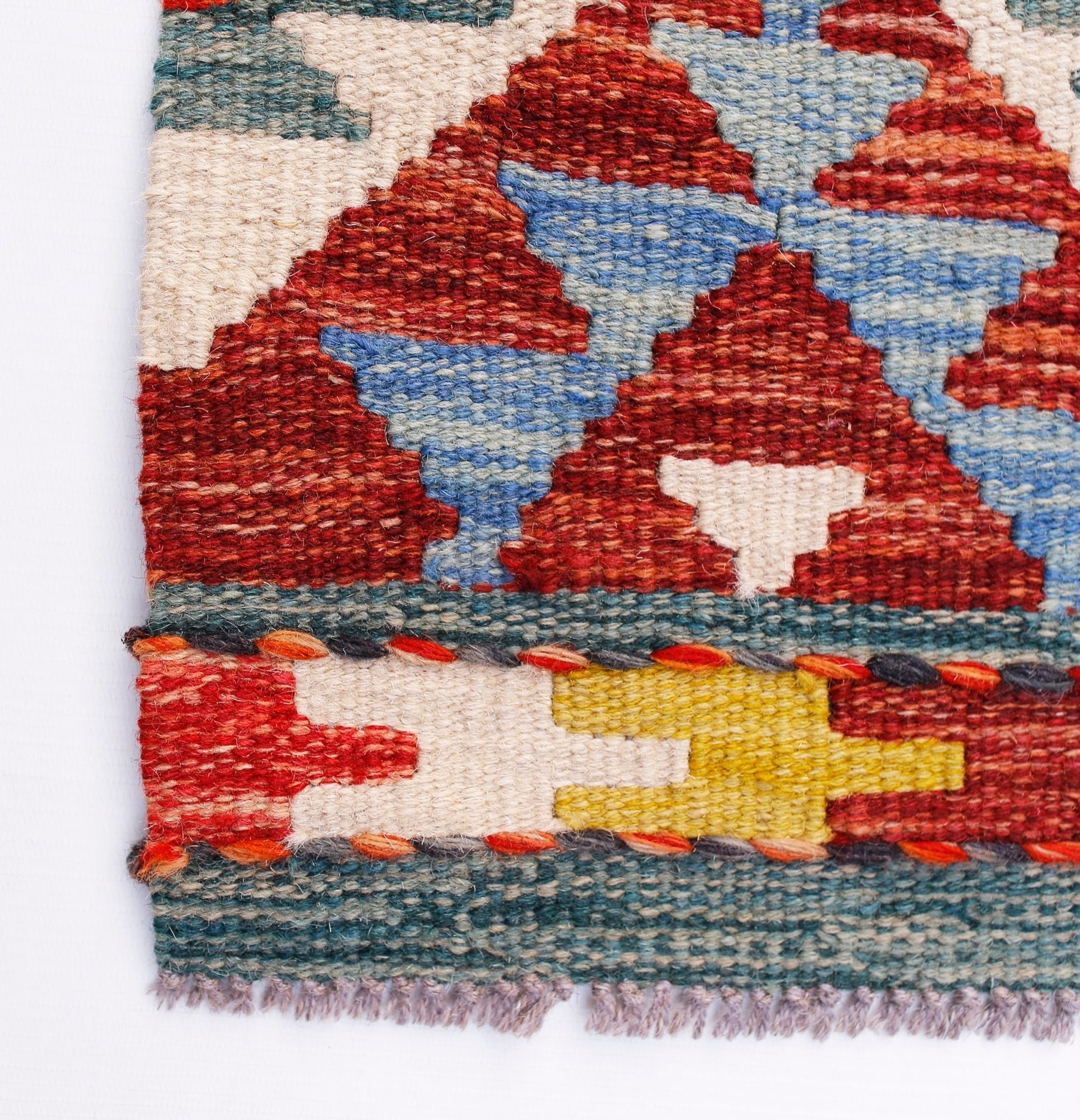 Handwoven Afghan Maimana wool kilim runner featuring geometric patterns in red, blue, and yellow.
