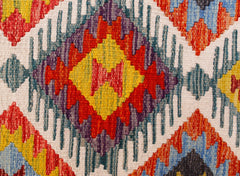 Handwoven Afghan Maimana kilim runner featuring a vibrant geometric diamond pattern in wool.