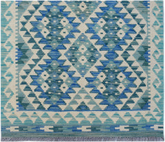 Handwoven Afghan Maimana wool runner featuring a geometric diamond pattern in shades of blue.