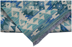 A handmade Afghan Maimana kilim runner featuring a geometric pattern in shades of blue and cream.