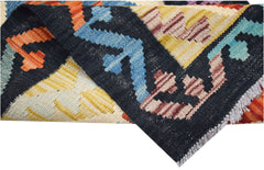 A handwoven Afghan Maimana kilim runner featuring a geometric pattern in vibrant wool colors.