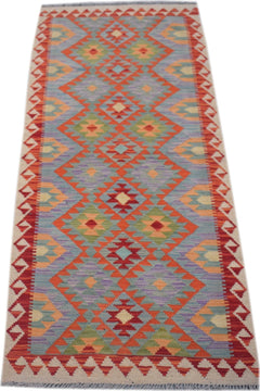 Handmade Afghan Maimana wool runner rug featuring a colorful geometric diamond pattern.