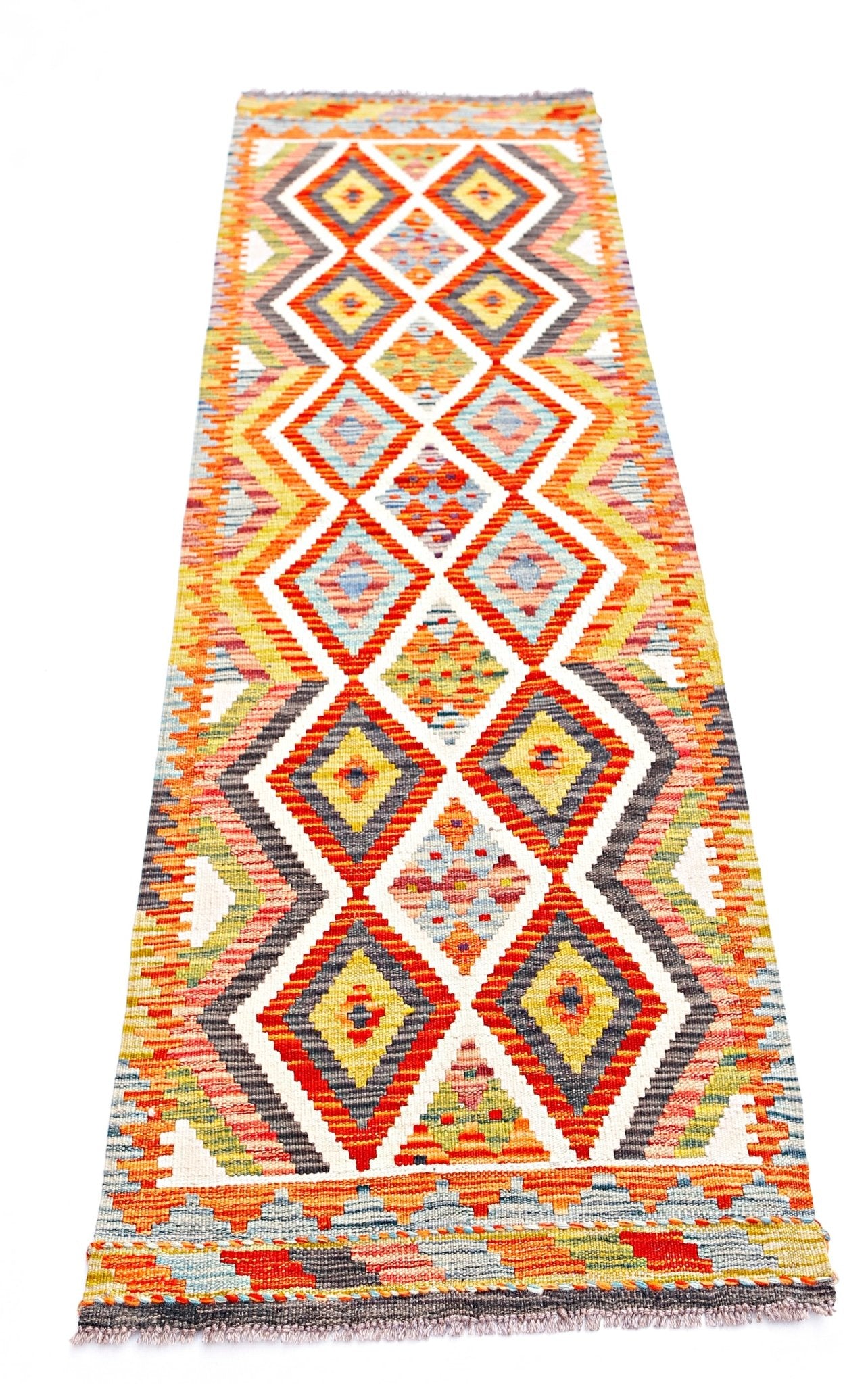 Handwoven Afghan Maimana wool runner rug featuring a colorful geometric diamond pattern.