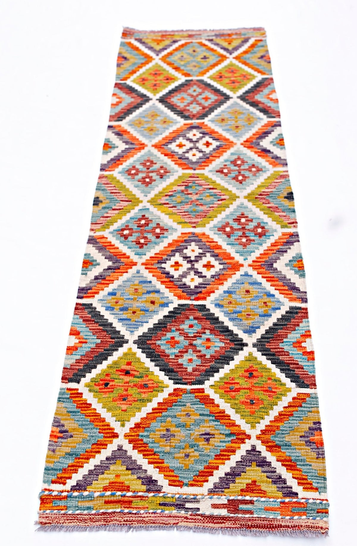 Handwoven Afghan Maimana wool runner rug featuring a colorful geometric diamond pattern.