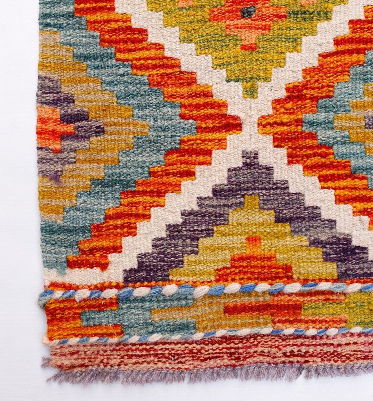 Handwoven Afghan Maimana wool kilim runner featuring a vibrant geometric pattern and fringe ends.