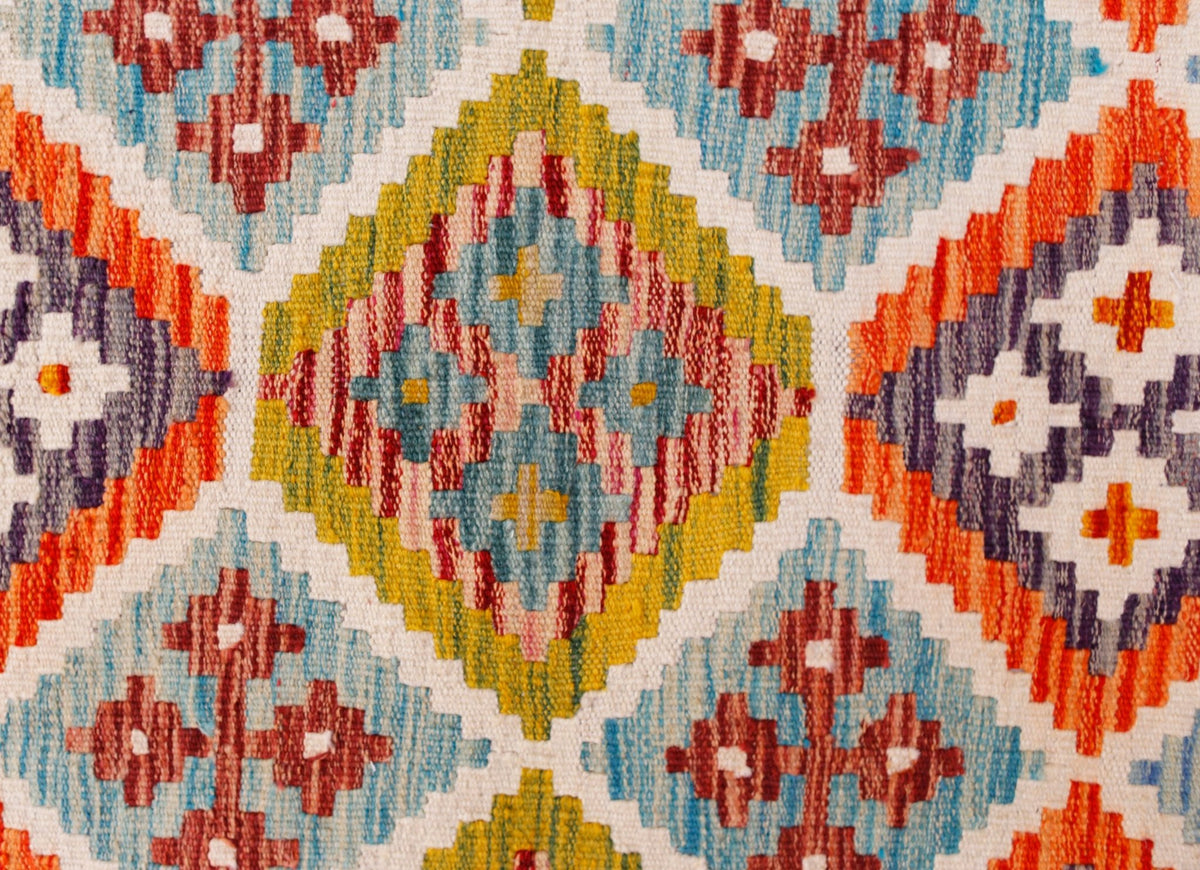 Handwoven Afghan Maimana kilim runner featuring a colorful geometric diamond pattern in wool.