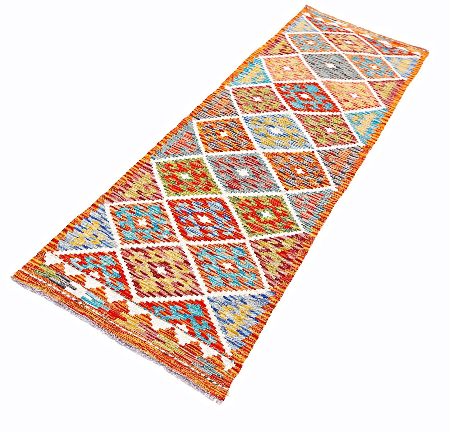 A handmade Afghan Maimana wool runner rug featuring a colorful geometric diamond pattern.