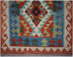 Handwoven Afghan Maimana kilim runner featuring a geometric diamond pattern in vibrant colors.