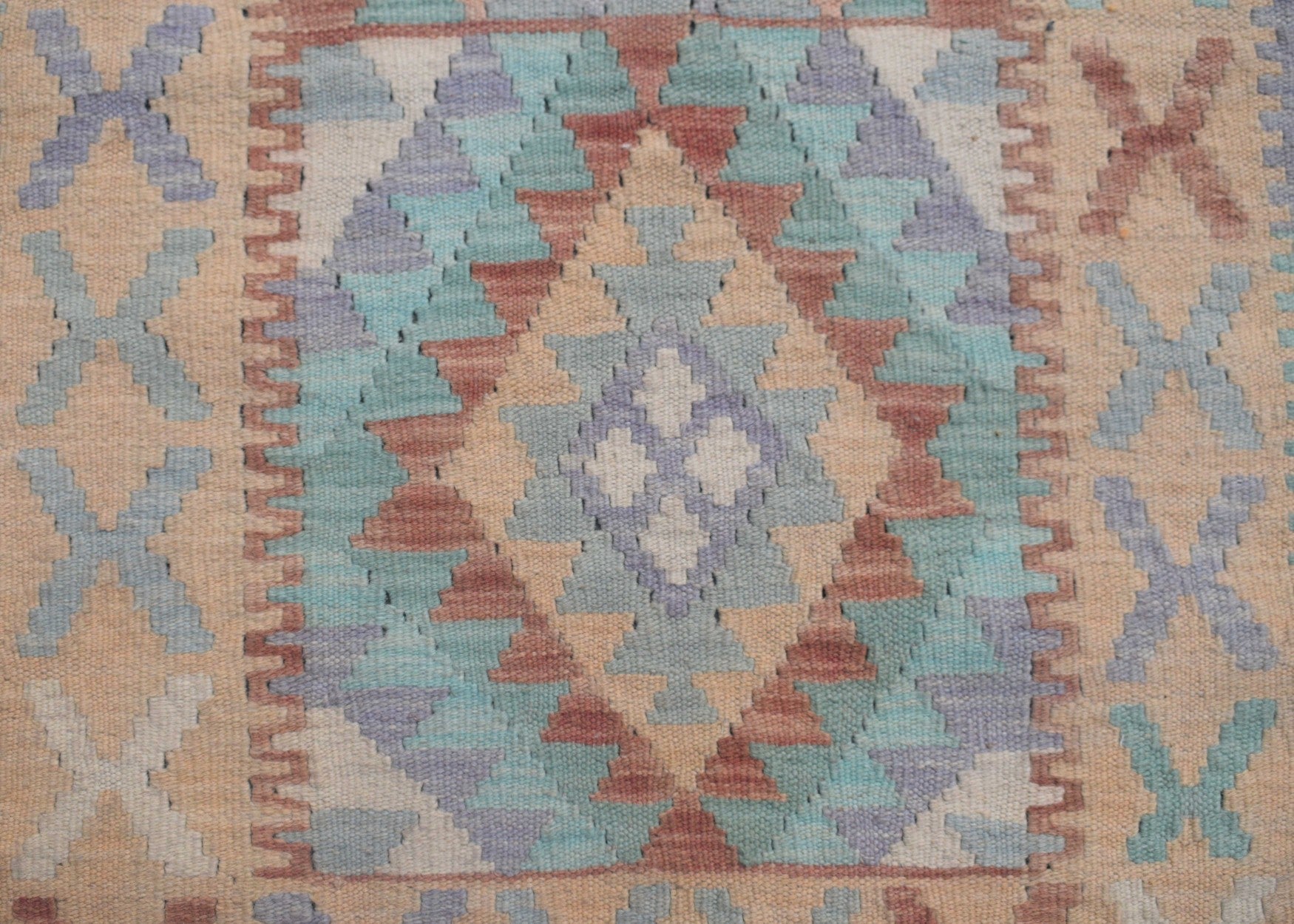Handmade Afghan Maimana kilim runner featuring a geometric diamond pattern in muted earth tones.