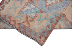 Handmade Afghan Maimana kilim runner featuring a geometric pattern in muted earth tones.