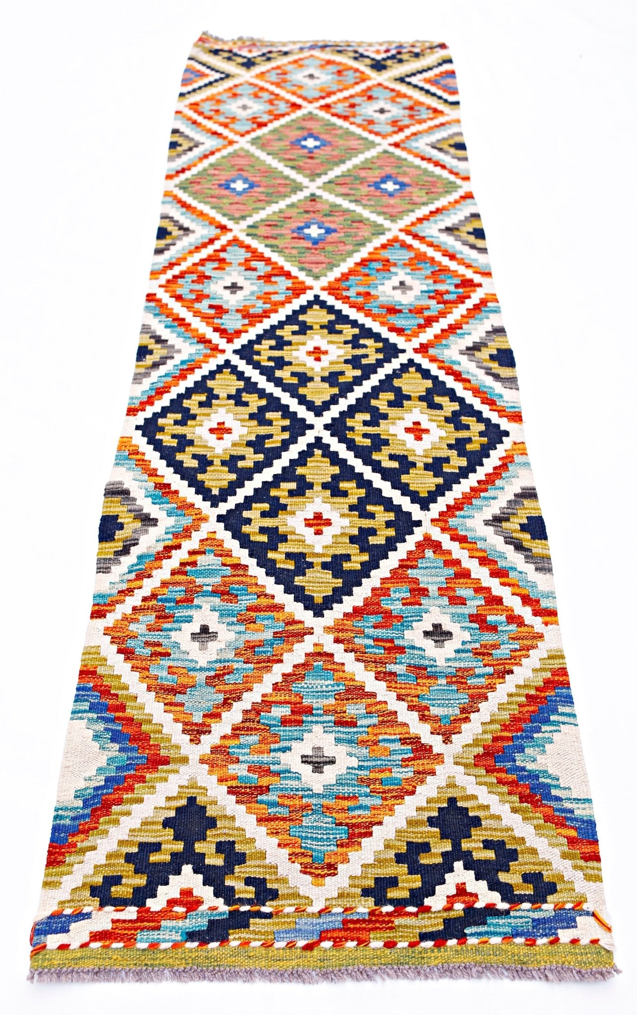 Handwoven Afghan Maimana wool runner featuring a colorful geometric diamond pattern.