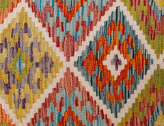 Handwoven Afghan Maimana wool kilim runner featuring a vibrant geometric diamond pattern.
