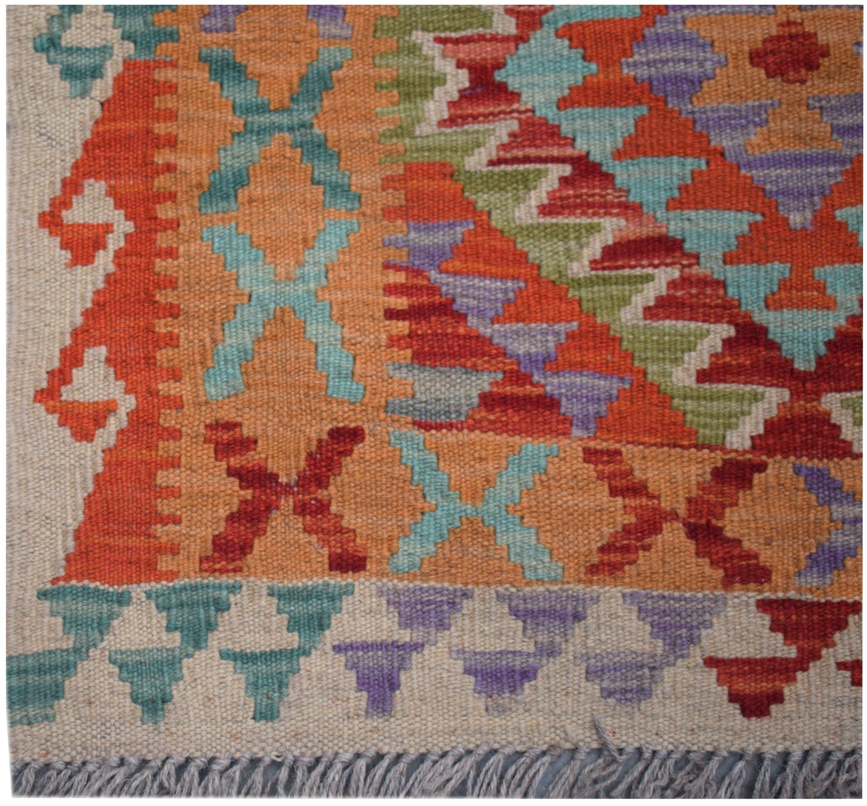 Handmade Afghan Maimana kilim runner featuring a geometric pattern in orange, red, blue, and purple.