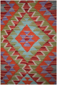 Handmade Afghan Maimana kilim runner featuring a vibrant geometric diamond pattern in wool.