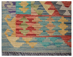 Afghan Maimana Kilim runner with geometric patterns in blue, yellow, red, and green.