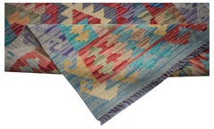 Handwoven Afghan Maimana wool runner featuring a colorful geometric pattern and fringed edges.