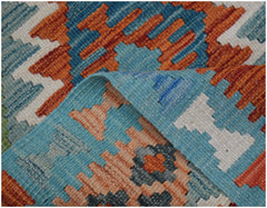 A handwoven Afghan Maimana kilim runner featuring a geometric pattern in orange, blue, and white.