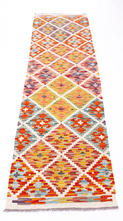 Handwoven Afghan Maimana wool runner rug featuring a colorful geometric diamond pattern.