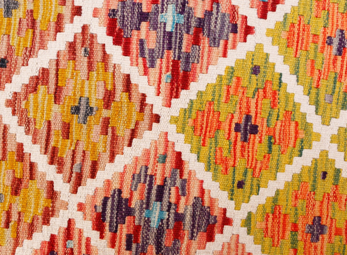 Handwoven Afghan Maimana kilim runner featuring a vibrant geometric diamond pattern in wool.