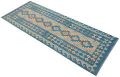 Handwoven Afghan Maimana wool runner rug featuring a blue background with geometric patterns.