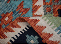A close-up of a handwoven Afghan Maimana kilim runner featuring geometric patterns in wool.
