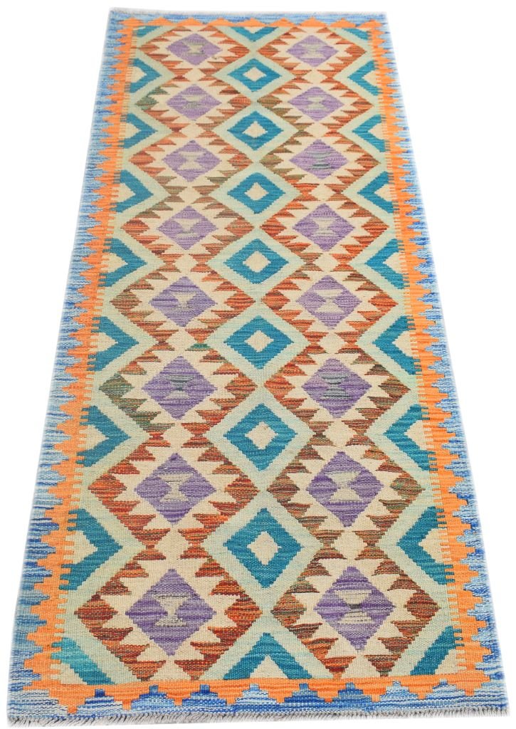 Handmade Afghan Maimana wool runner rug featuring a geometric diamond pattern in vibrant colors.