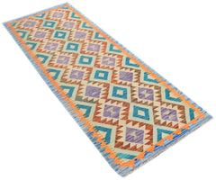 A handmade Afghan Maimana kilim runner featuring a geometric diamond pattern in vibrant colors.