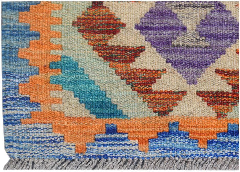 Handmade Afghan Maimana kilim runner featuring vibrant geometric patterns in wool.