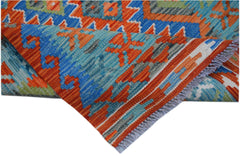 A handwoven Afghan Maimana kilim runner featuring geometric patterns in blue, orange, and green.